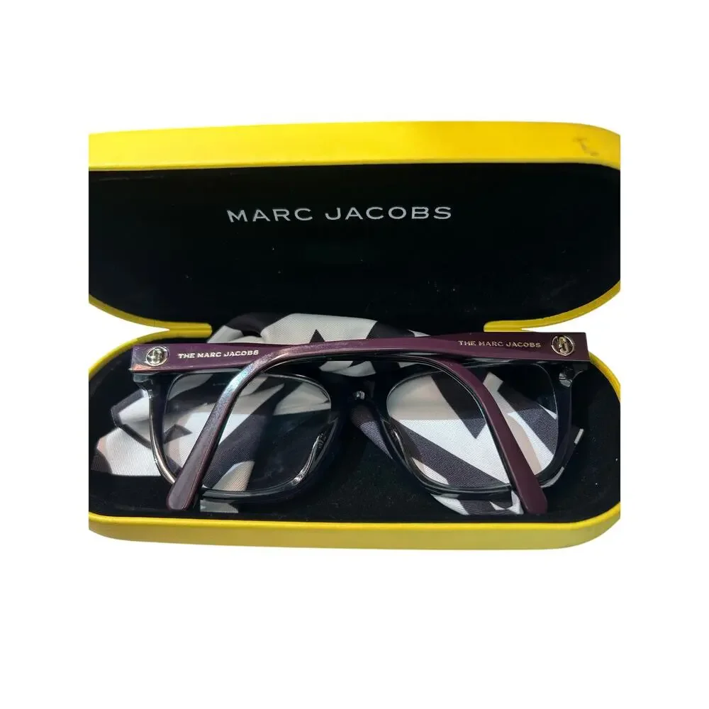 Marc Jacobs purple glasses frames with lenses yellow case, cleaning cloth.